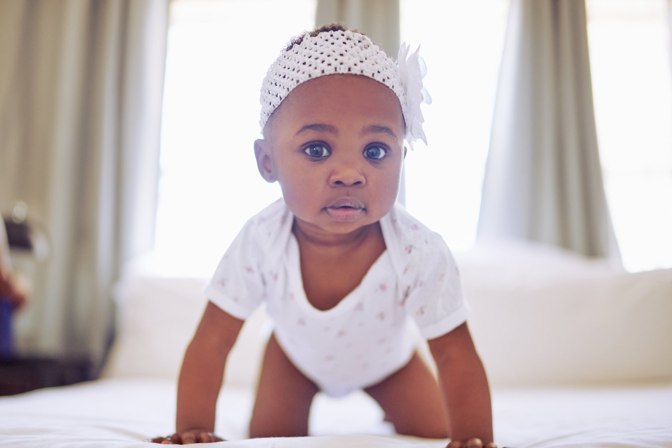 Baby girl in a white headband