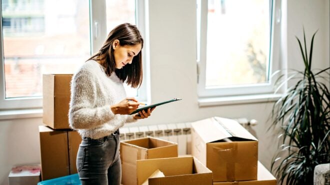 A woman packing up a house