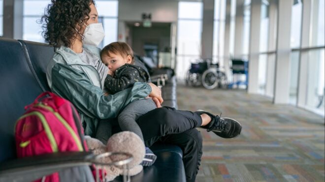 A mom nursing her son at the airport