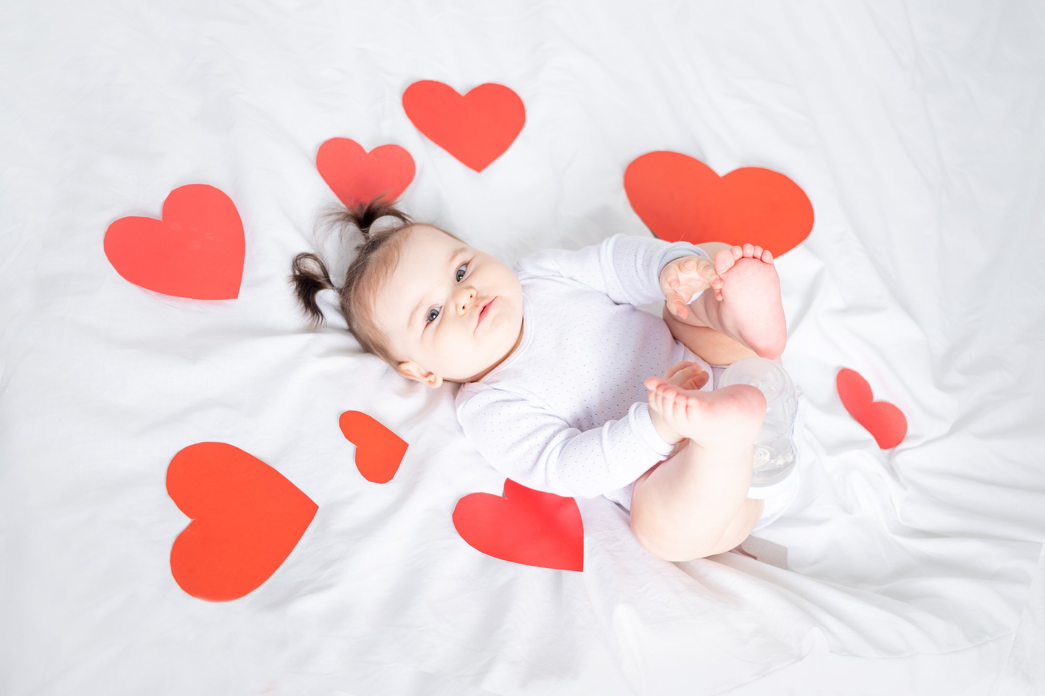 baby with red hearts, valentine's day concept
