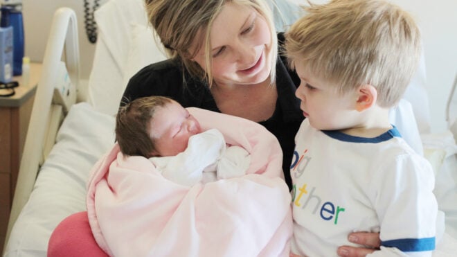 mom newborn toddler in hospital