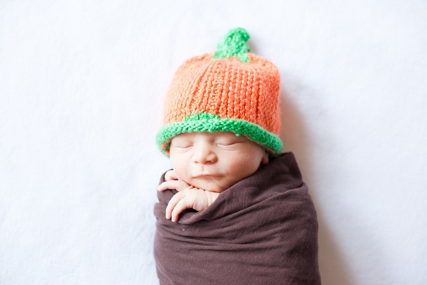 Baby in a pumpkin hat