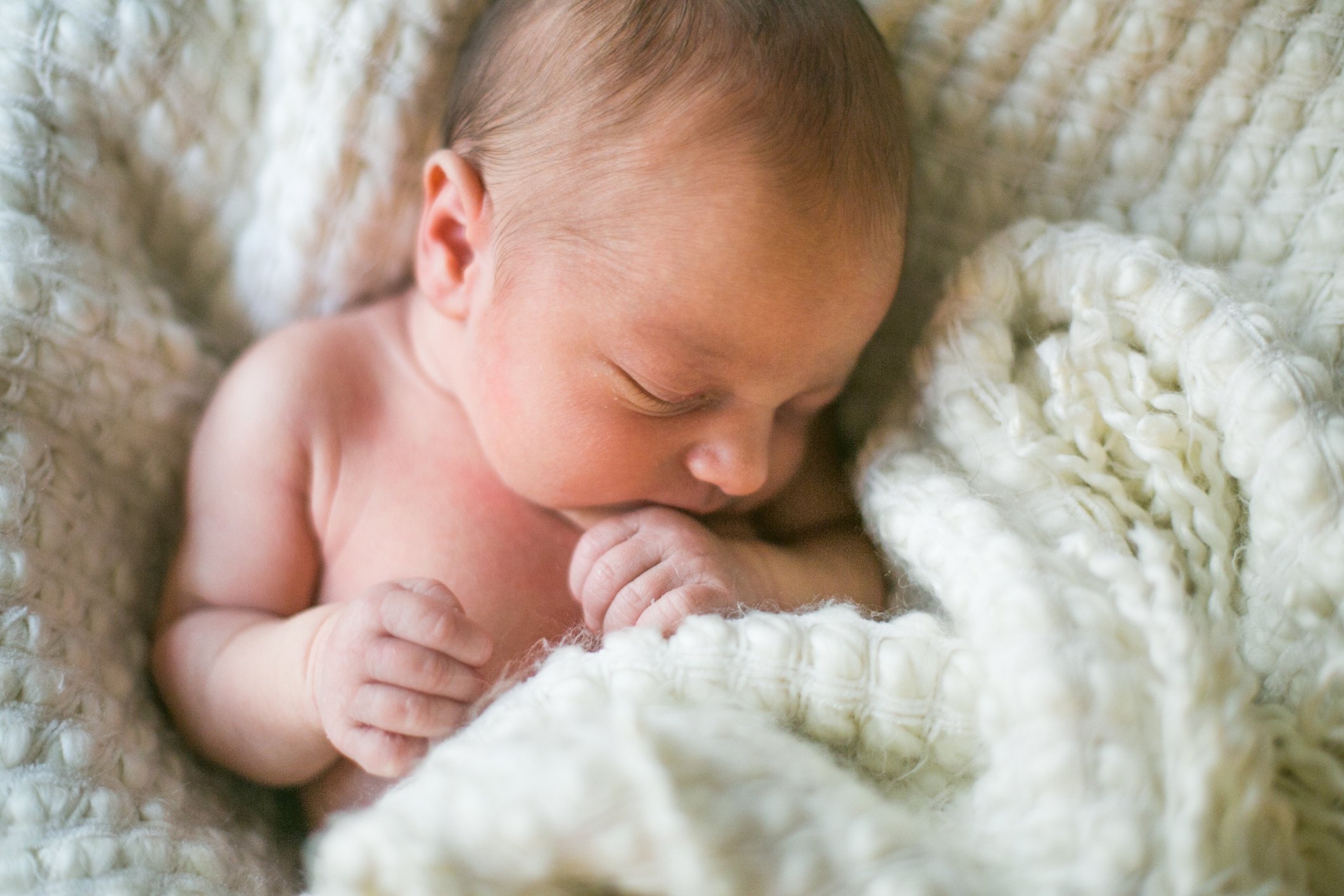 Newborn sleeping in blanket